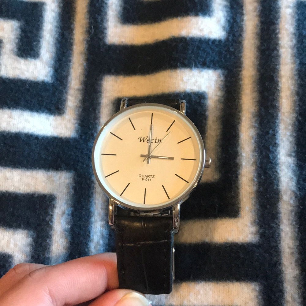 Silver watch with a black band